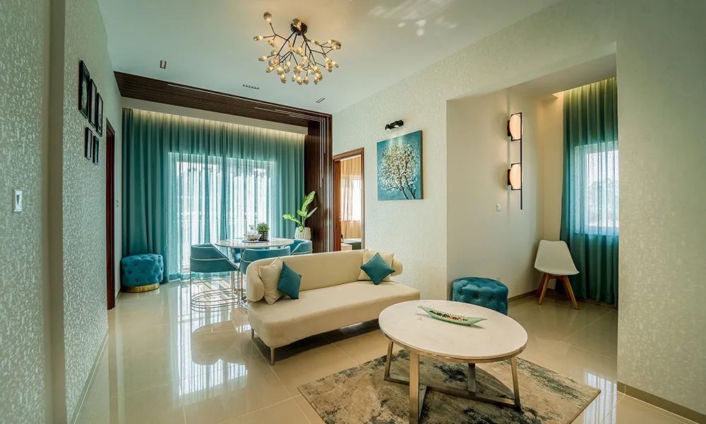 Elegant living room with blue ottoman